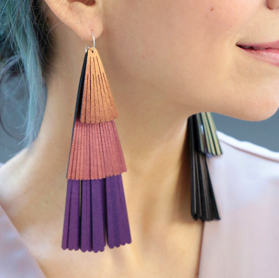 Color shifting iridescent fan fringe earrings. Made with amethyst, fuchsia and ruby vegan leathers.