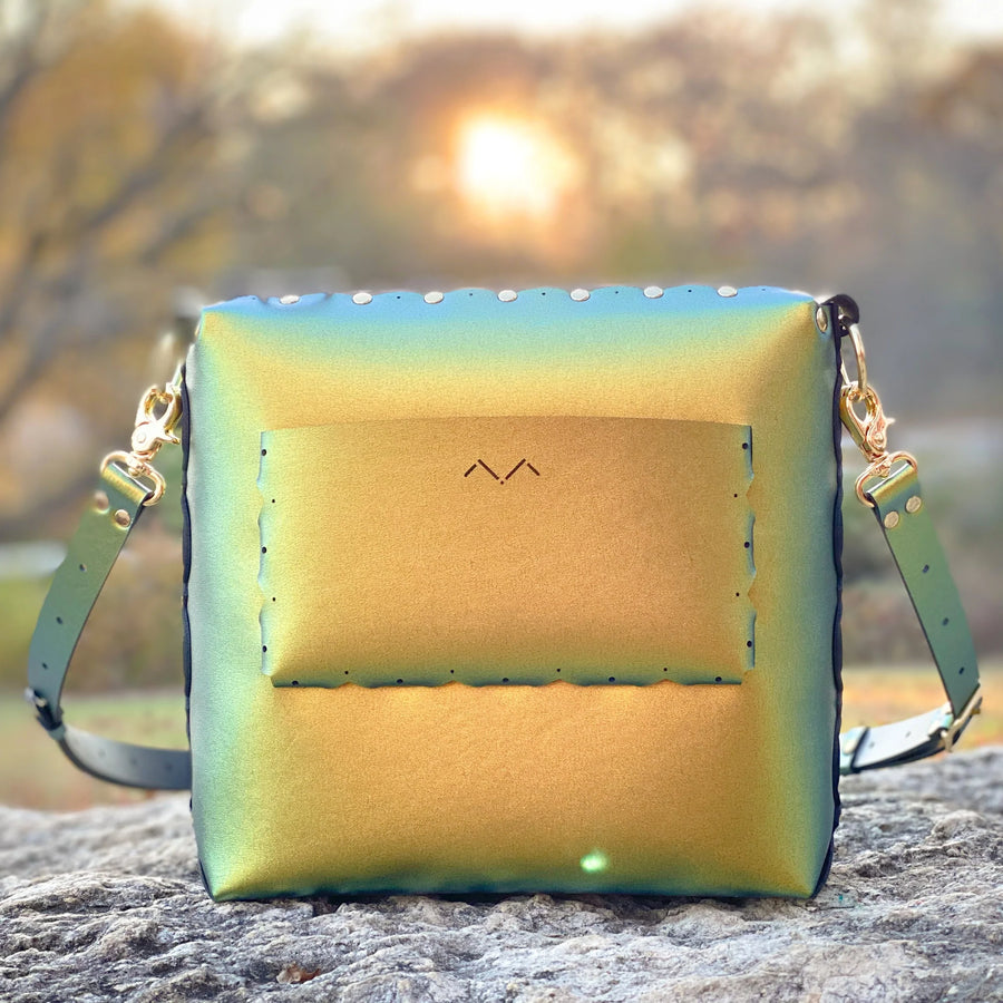 Scarab medium crossbody bag photographed during sunset